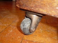 old castor tyre with chunk out of it